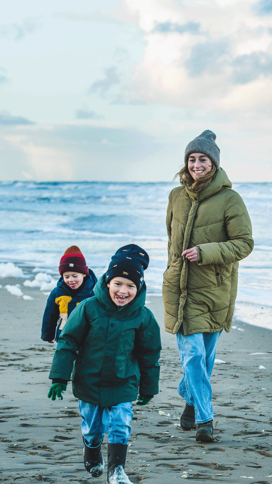 AholdDelhaize_Careers_Ahold Delhaize_Frederieke Haas van de Vlekkert_Finance_walking_with_two_kids_on_the_beach_vertical.png